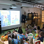 CEO Beth Reads to kids at Museum of science