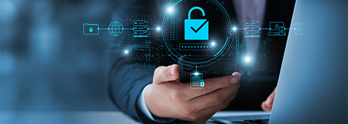 Person holding a phone on a computer with a secure lock